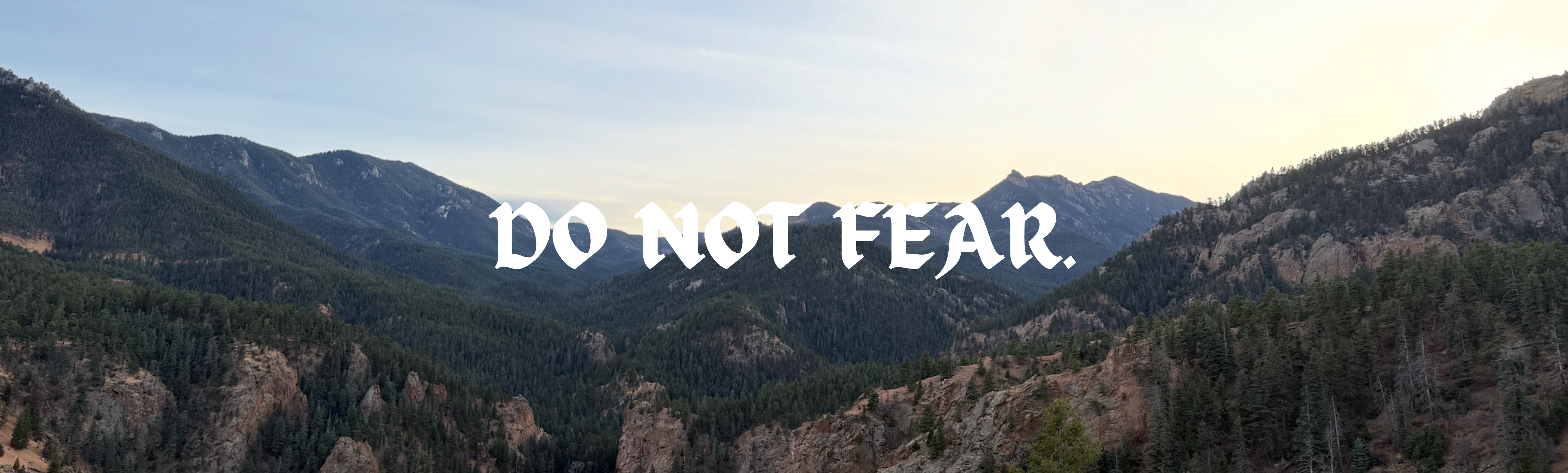 Mountain landscape with 'DO NOT FEAR' text overlay
